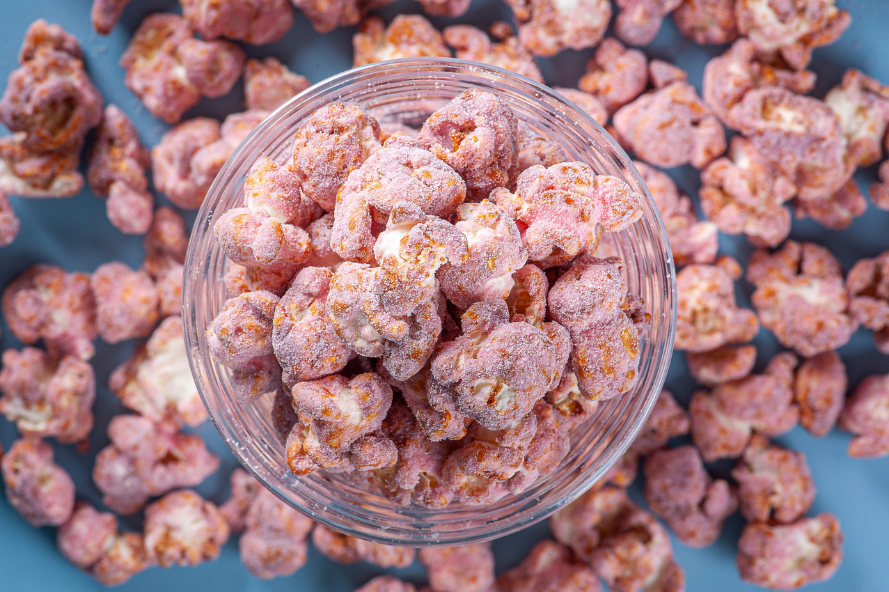 Gourmet sweet popcorn in close-up photo. Strawberry flavor.